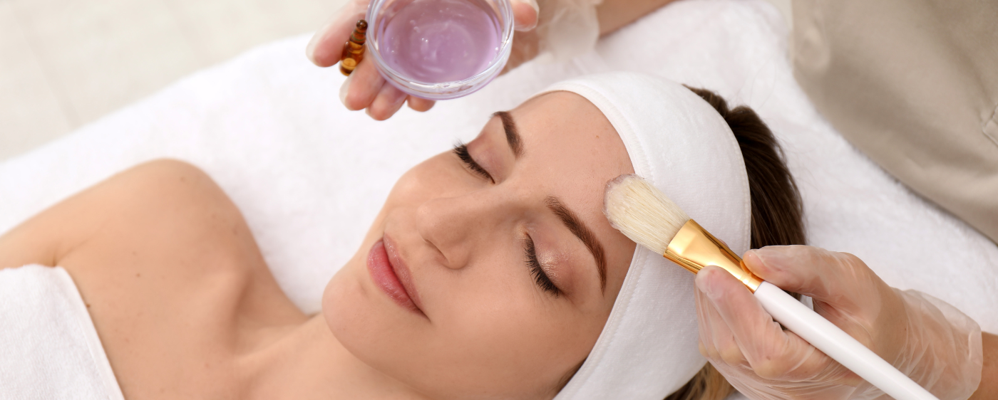 Chemical peel treatment being applied with a brush at our Birmingham clinic